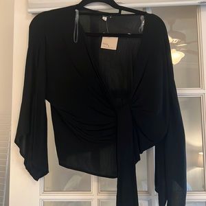 Quarter sleeve black wrap crop.